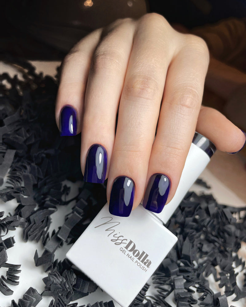 Professional-grade dark purple UV/LED gel nail polish by Miss Dolla, perfect for salon use.